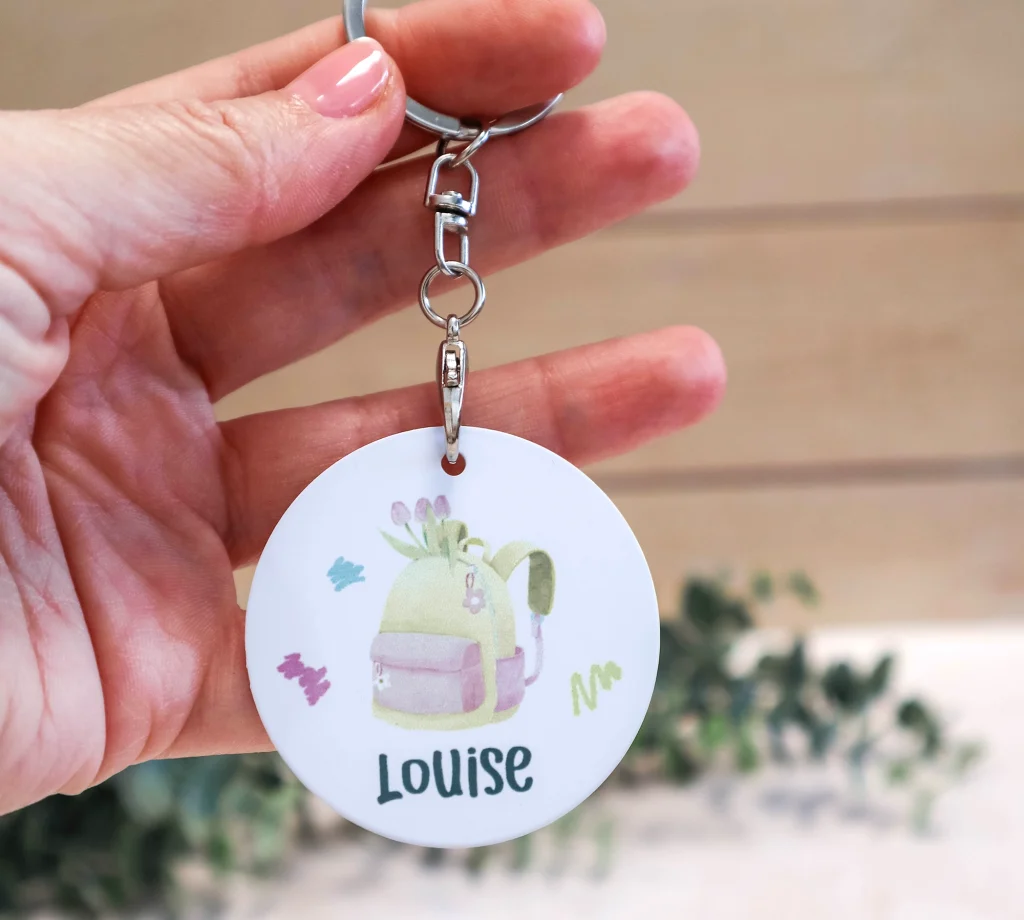 Les petits mots qui font grandir | Collection Rentrée 14 Porte-clé rond personnalisé enfant avec prénom et illustration colorée